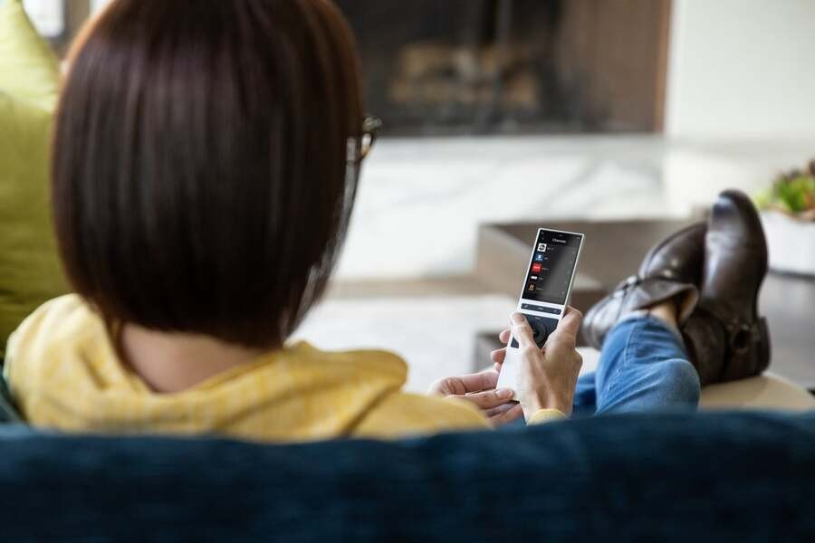 A luxury home theater with a top-quality projector displaying a landscape.