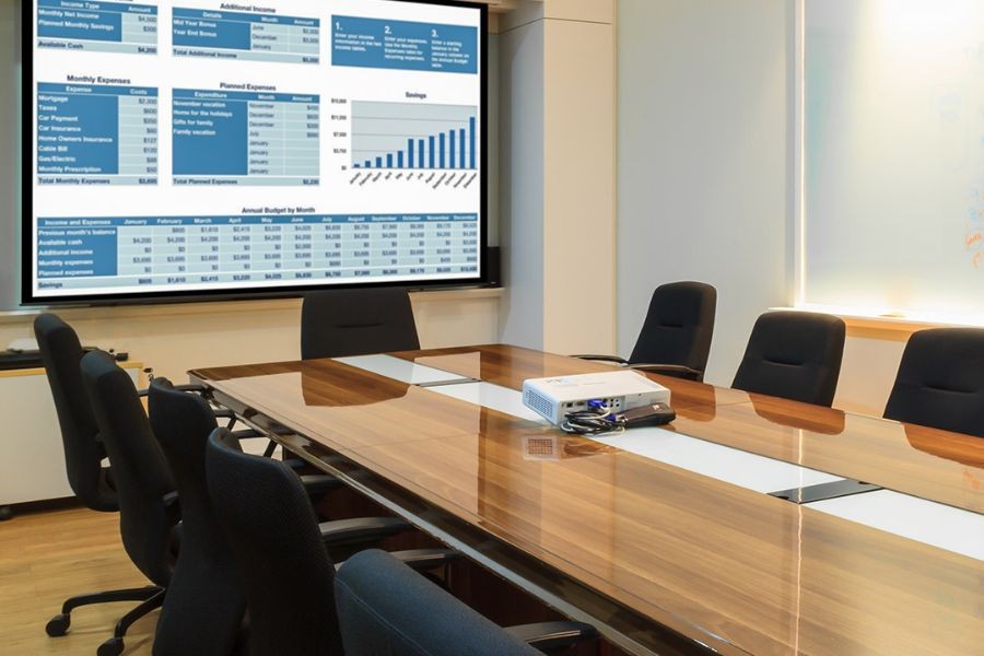 Photo of a business boardroom with Control4 technology, including an interactive display. 