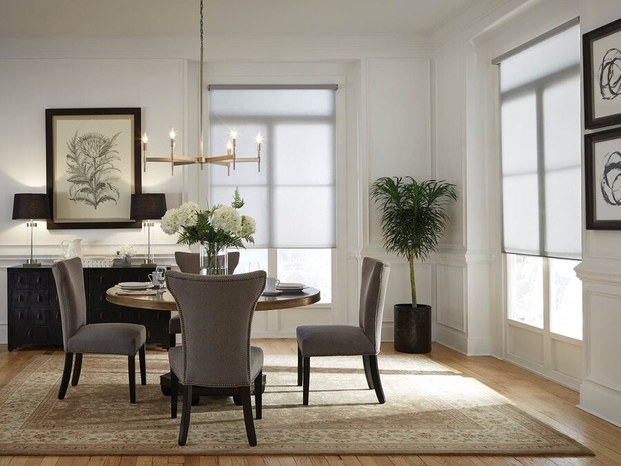 A dining room featuring Lutron motorized shades.