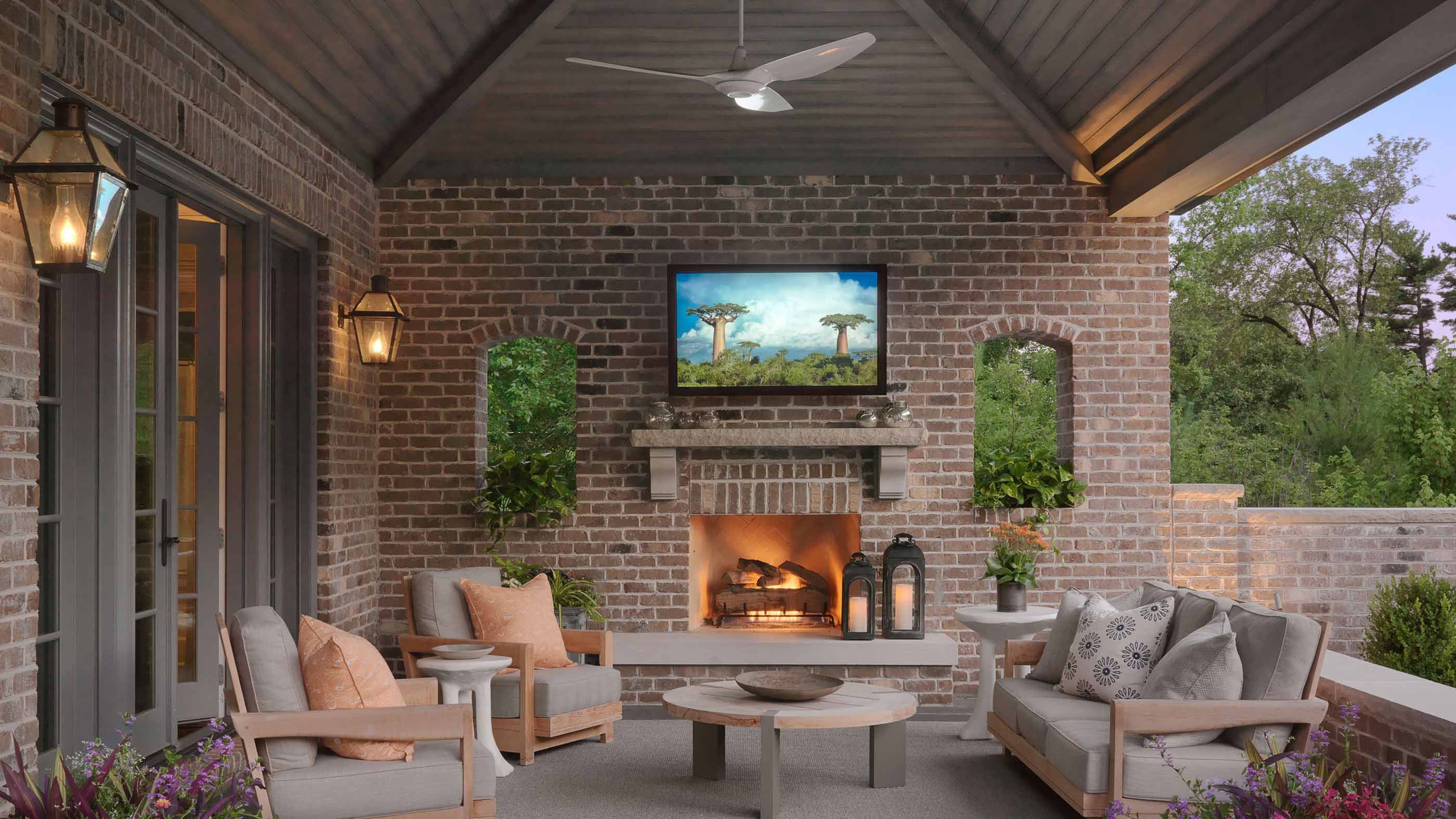 brick walls in patio with tv mounted on wall